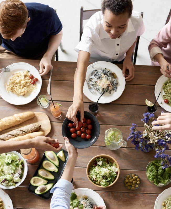 A family feasting at the dining table.